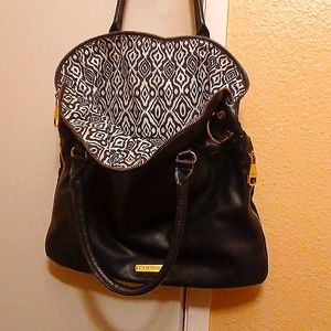 Steve Madden Black & Gold, Leather hobo bag with African Print inside.